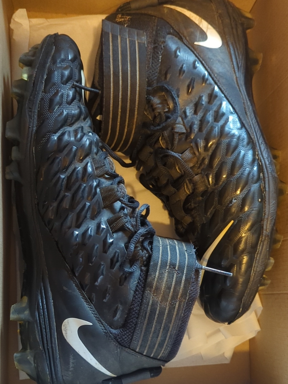 Nike Men’s Black Cleats with White Swoosh